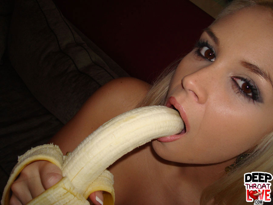 Girl deepthroats banana.