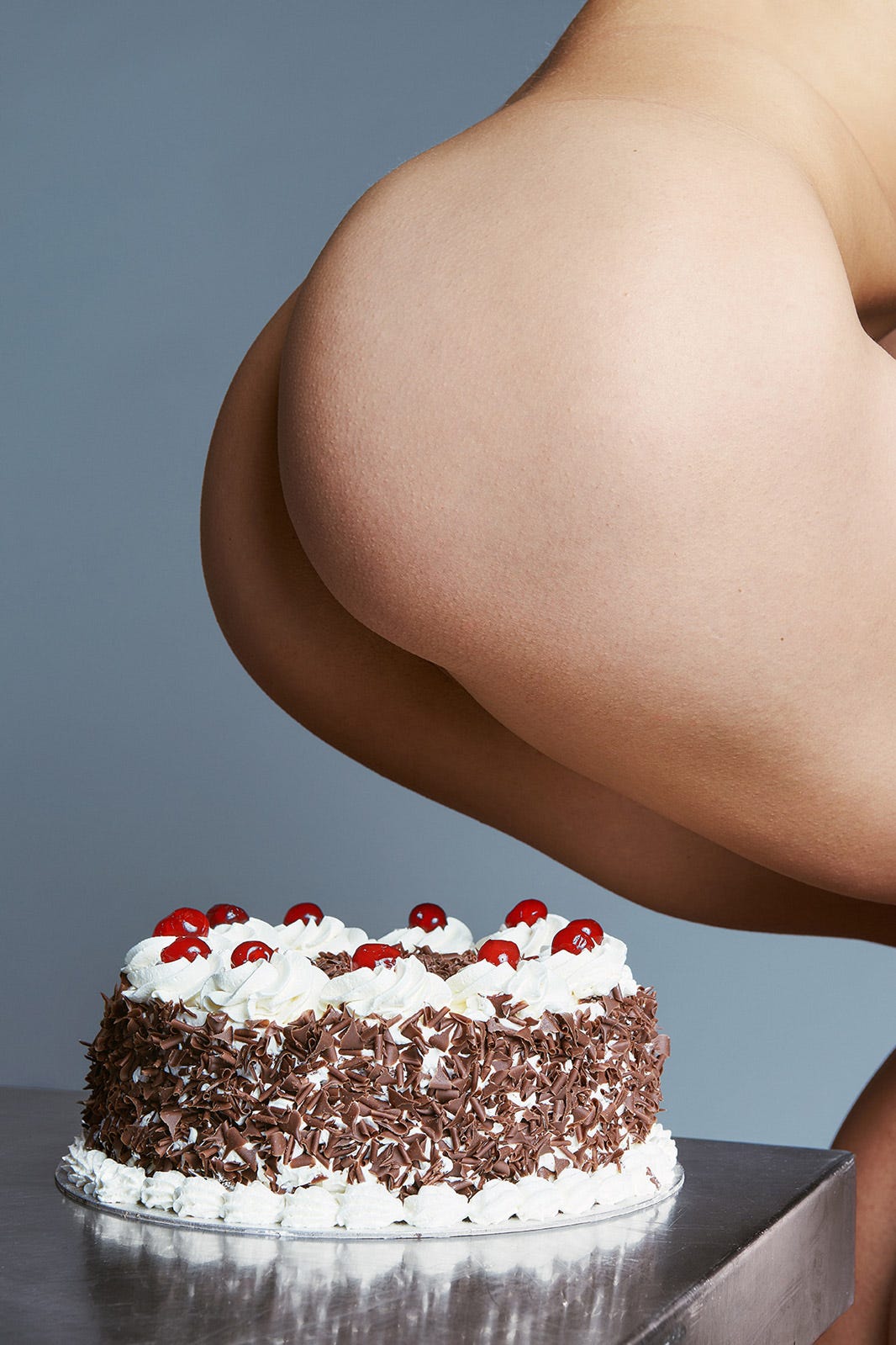 Naked man on cake